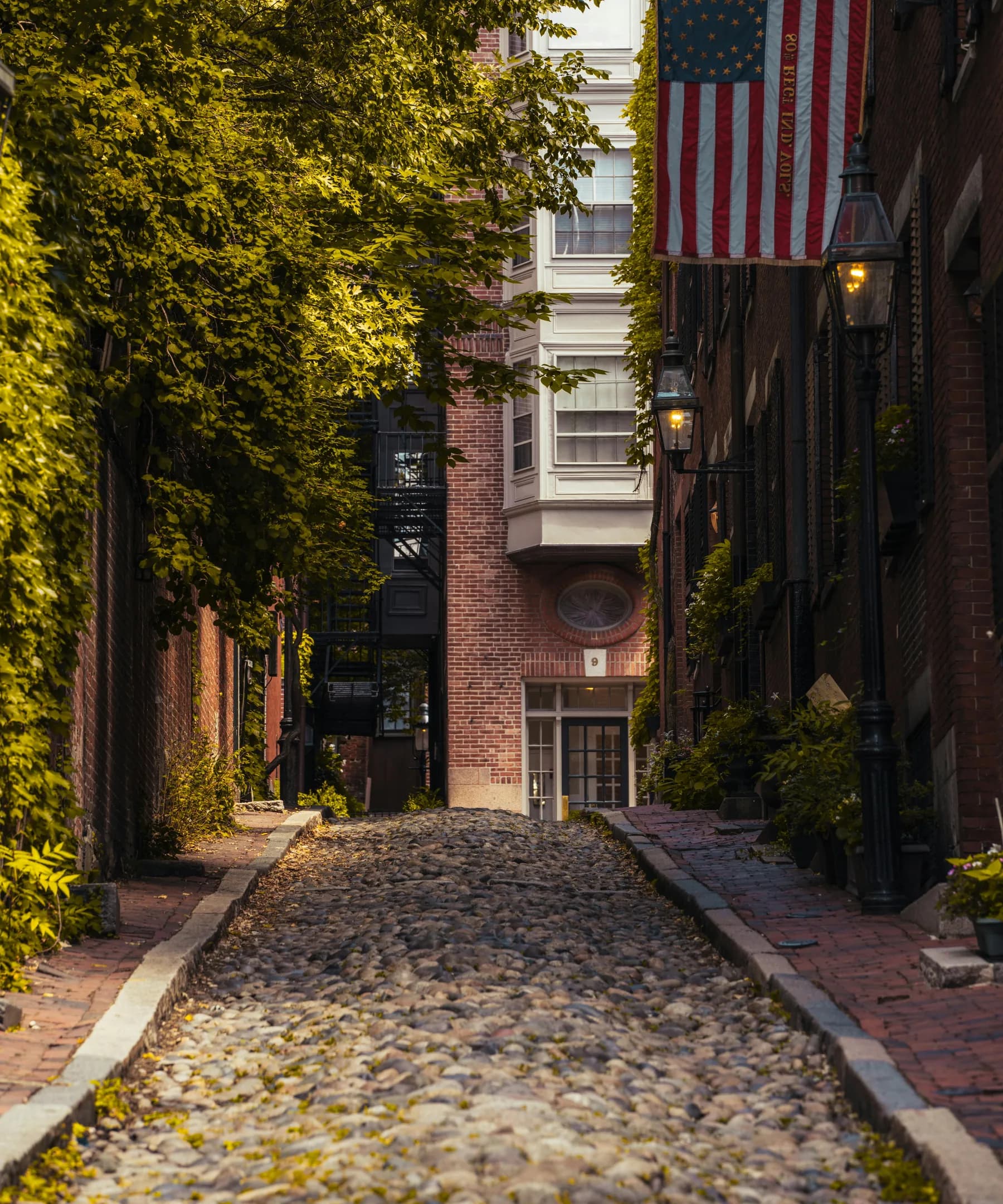 Boston cobblestone street with historic brownstones