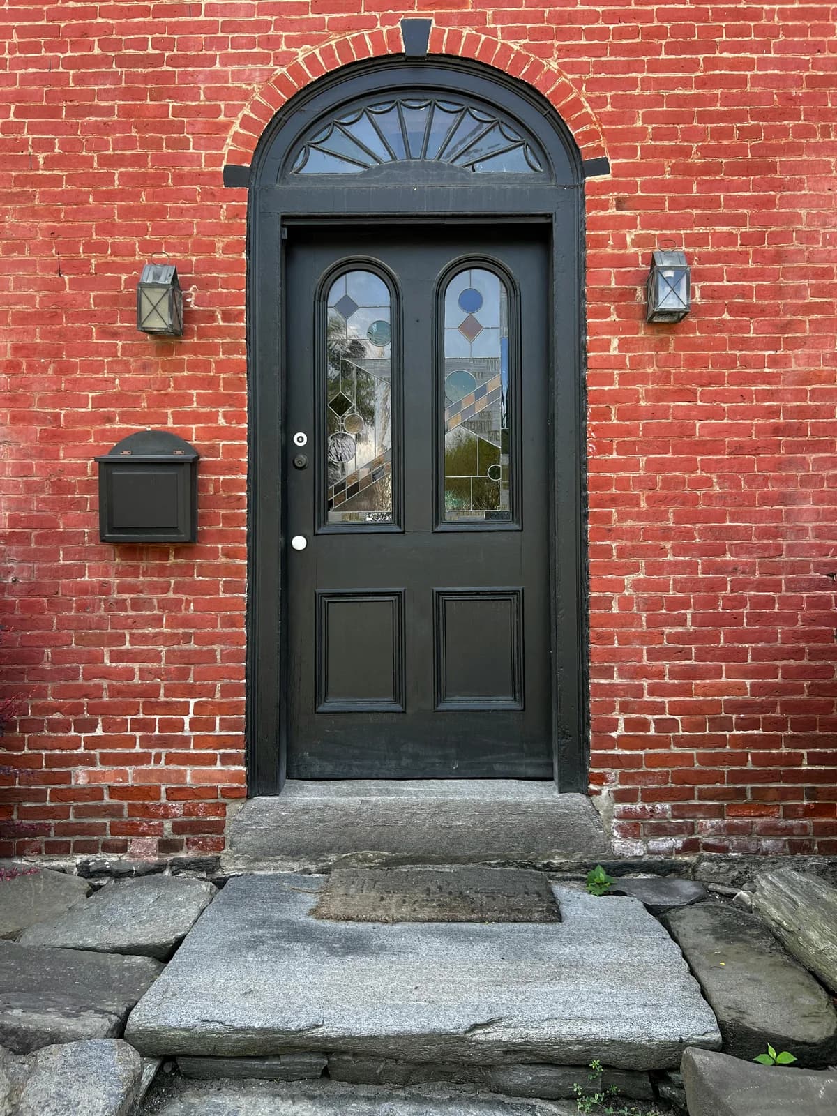 Brick building with front door in New England